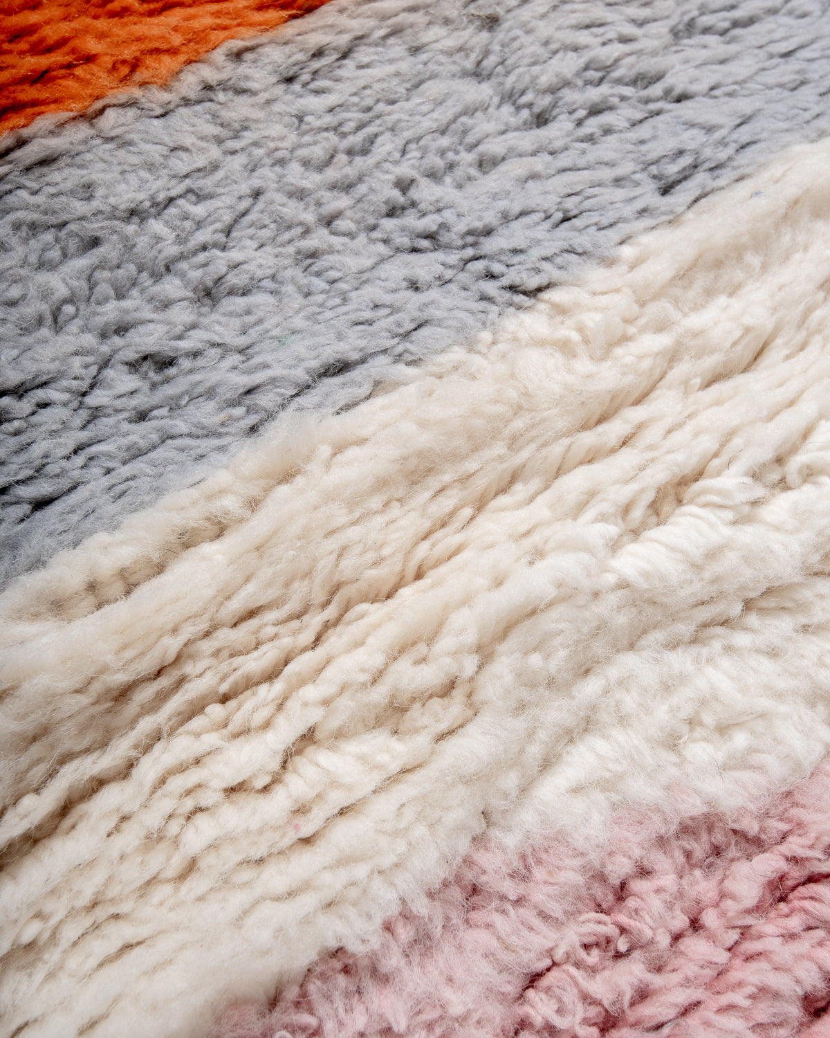 Modern, designer, handcrafted Berber rug from Morocco. Beniourain carpet with beautiful colours and patterns and fluffy wool texture.